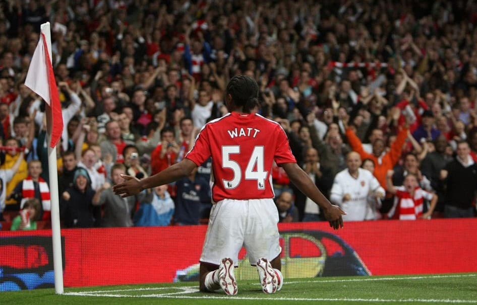 Sanchez Watt — no. 54 — walking on the Arsenal pitch